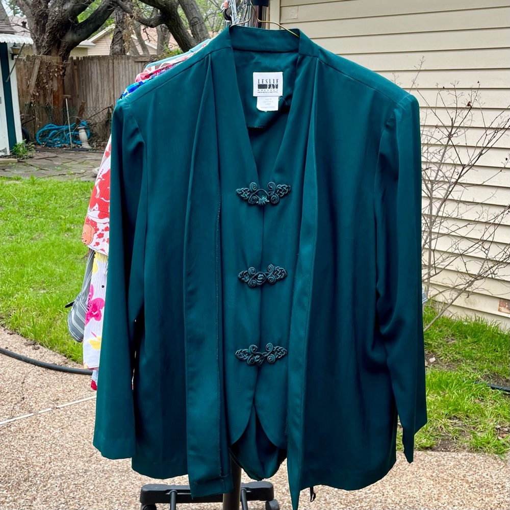 Beautiful emerald pantsuit, vest layer, unique closure.